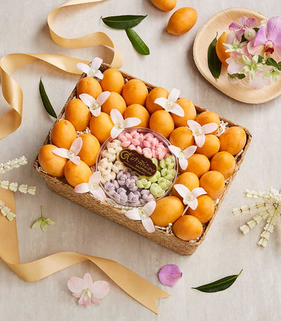 Premium plum and Thai Kleeb Lamduan fruit gift basket with orchids and pastel confections