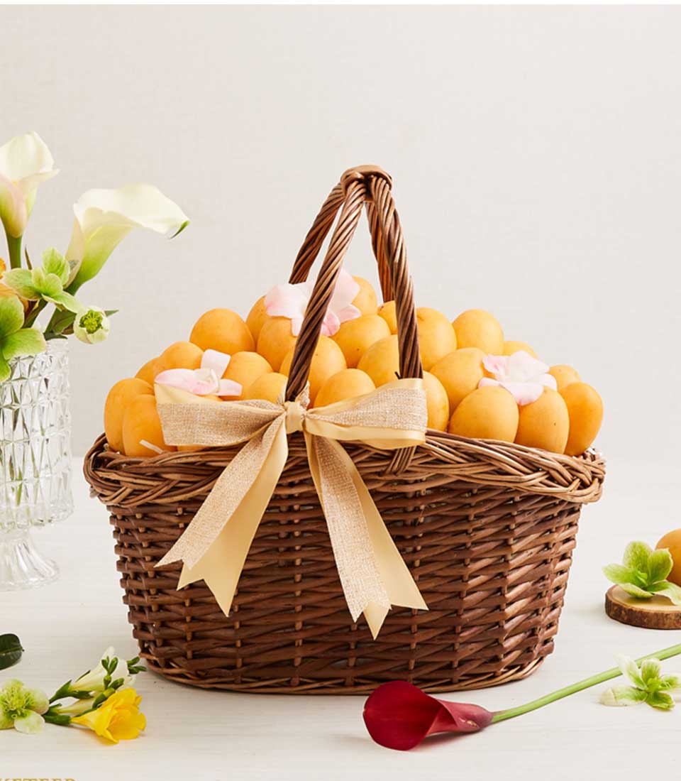 Golden marian plum gift basket with fresh flowers and gold ribbon bow