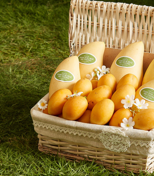 Premium Thai mango gift basket with Nam Dok Mai and Mayongchid fruits in wicker with lace-lined presentation