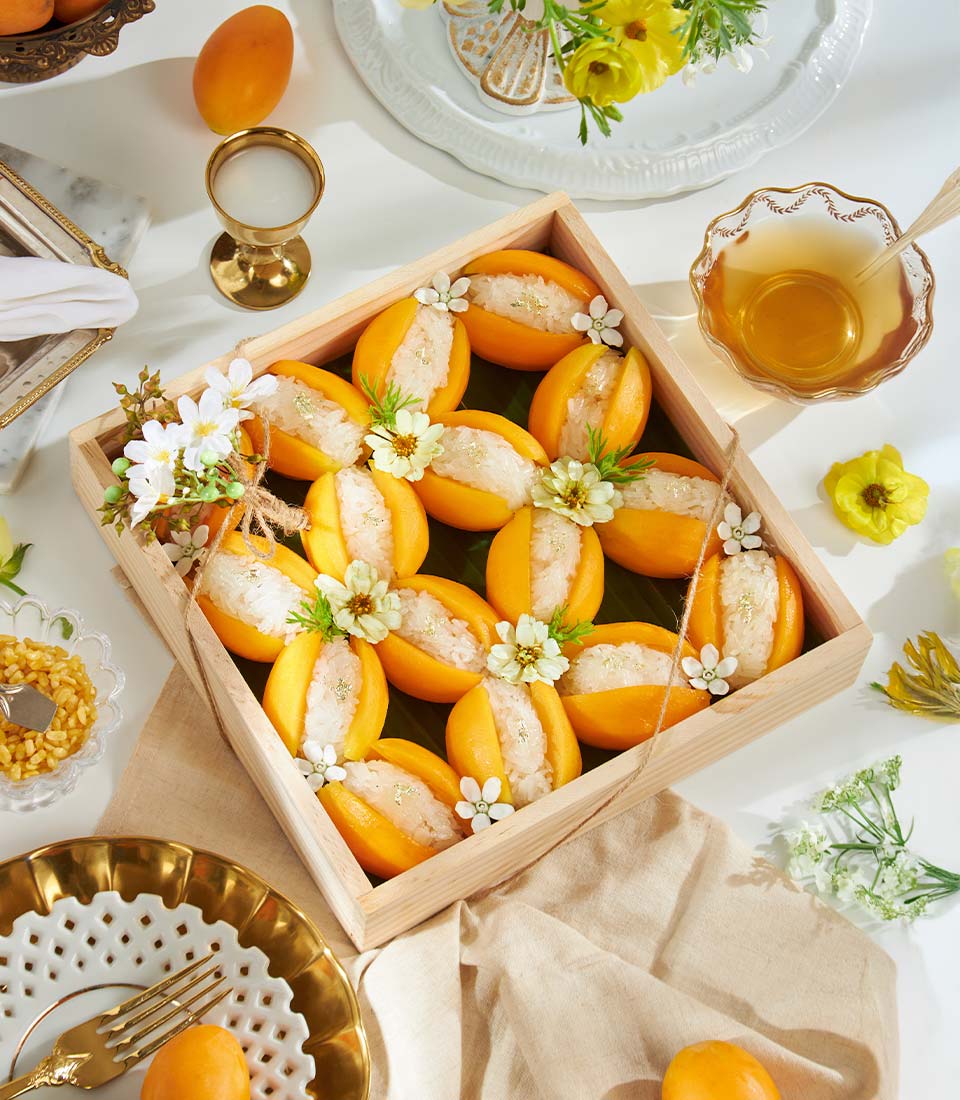 Premium mango sticky rice desserts in mango shells with gold leaf, artisan add-on gift box
