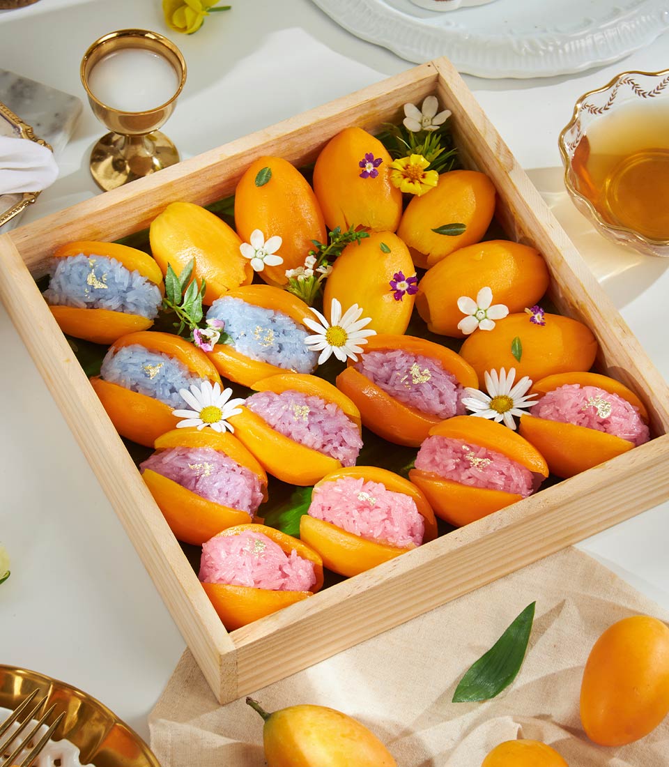 Premium Mayongchid with sticky rice gift box featuring Thai marian plums, colorful rice filling, and gold leaf accents