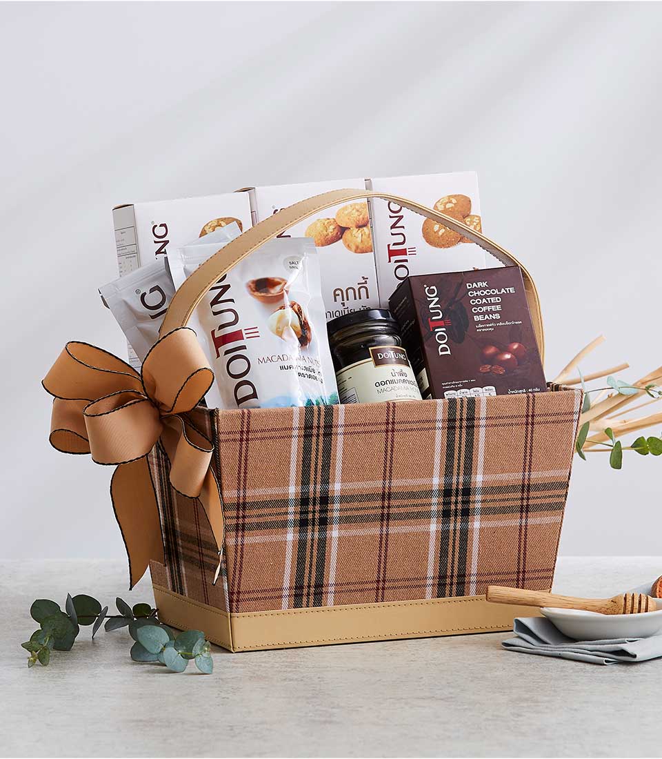 Brown plaid gift basket with Doi Tung cookies, macadamia nuts, dark chocolate coffee beans, and luxury gourmet treats