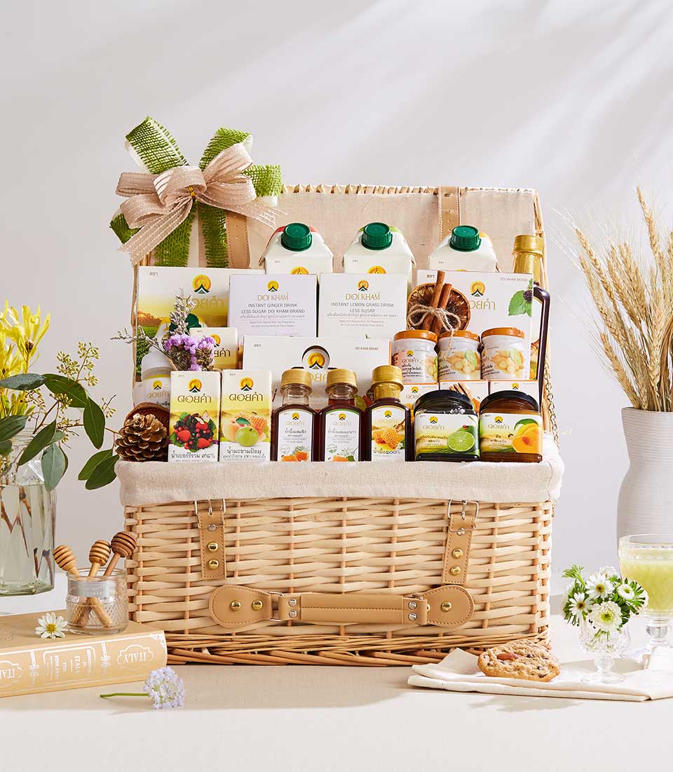 Timeless Doi Kham wicker gift hamper with honey, preserves, and wellness products, light brown with satin bow