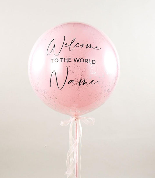 Personalized pink welcome balloon with silver confetti and pink ribbon bow