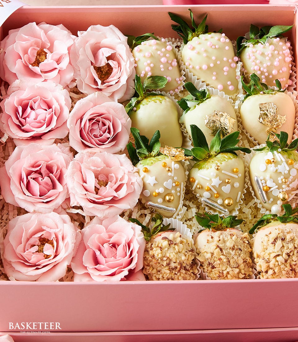 Pink roses and chocolate-covered strawberries in luxury gift box for Valentine's Day