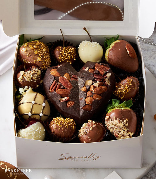 Luxury chocolate heart with dipped strawberries and gourmet sweets in white gift box for Valentine's Day