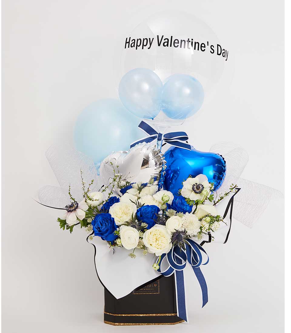 Royal blue and white rose arrangement with Valentine's balloons in luxury gift box
