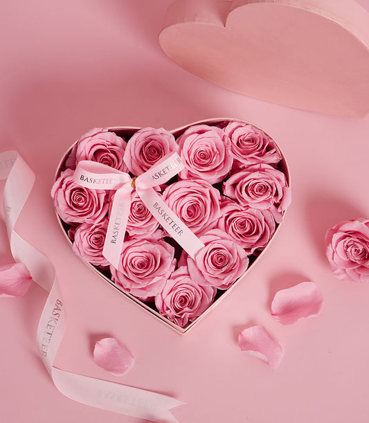 Elegant preserved light pink rose arrangement from Flowers by Basketeer. Premium flowers in a heart-shaped gift box, perfect for flower delivery Bangkok.