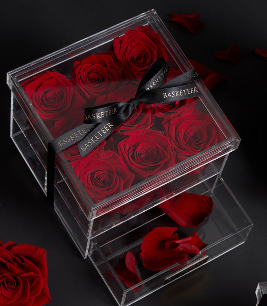 Elegant Flowers by Basketeer preserved red roses in a modern acrylic gift box with drawer and branded ribbon. Perfect for premium flower delivery Bangkok.