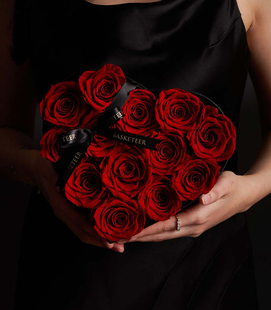 Elegant heart-shaped flower box from Flowers by Basketeer filled with premium red roses. Perfect for same-day flower delivery in Bangkok, Thailand.
