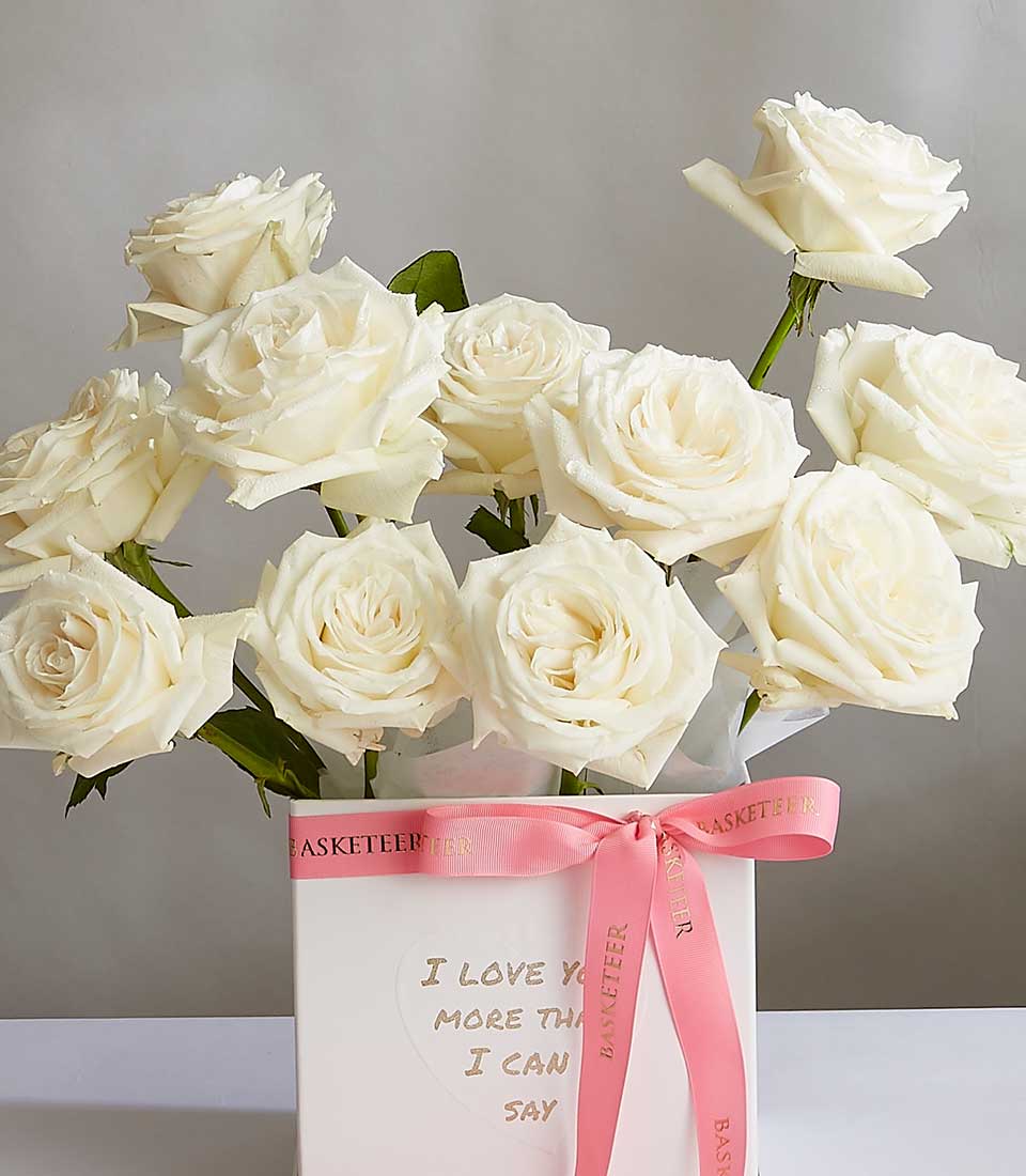 White roses in gift box with pink ribbon, Basketeer Ivory Bloom collection for birthdays and romantic occasions