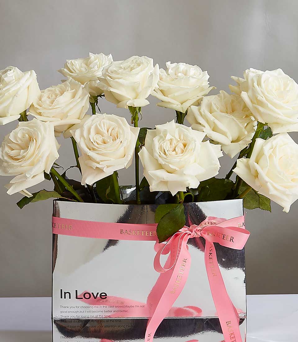 White roses luxury gift box with pink ribbon bow, premium flower gift for her