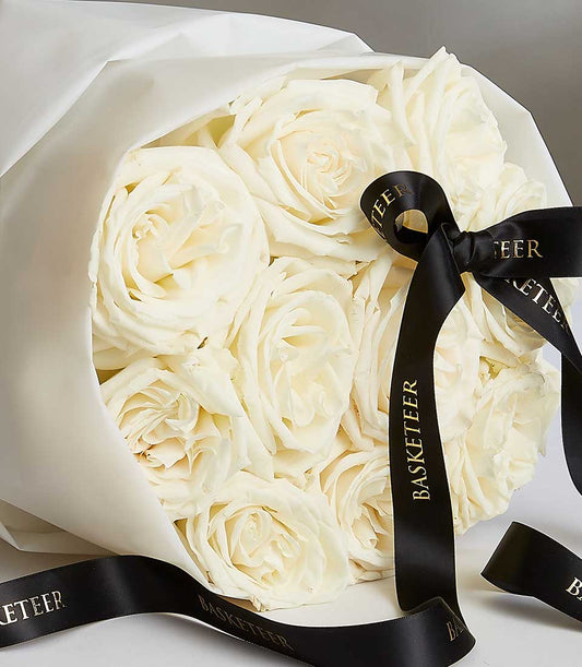 Fresh white Playa Blanca roses luxury bouquet with cream wrapping and branded ribbon, ideal birthday gift for her