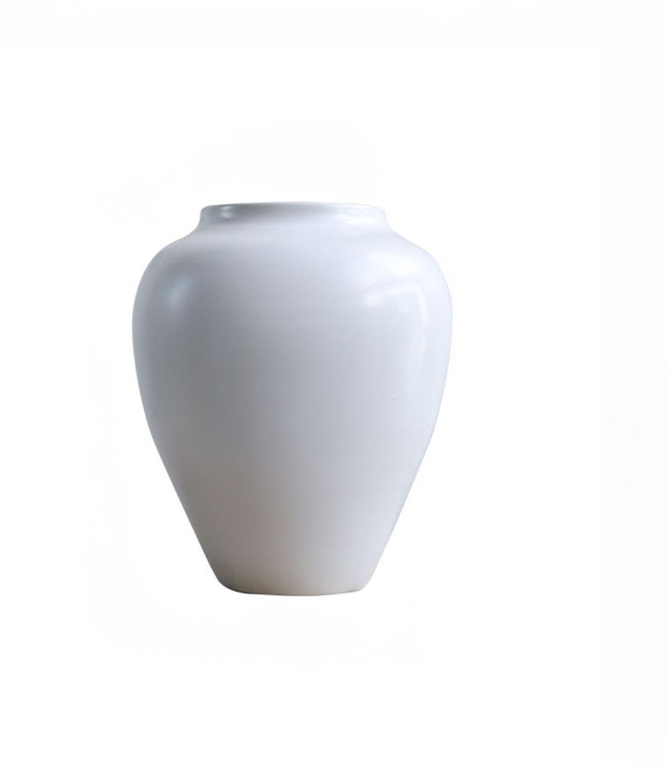 Smooth white ceramic vase with tapered classic shape, perfect for fresh flowers or minimalist home décor
