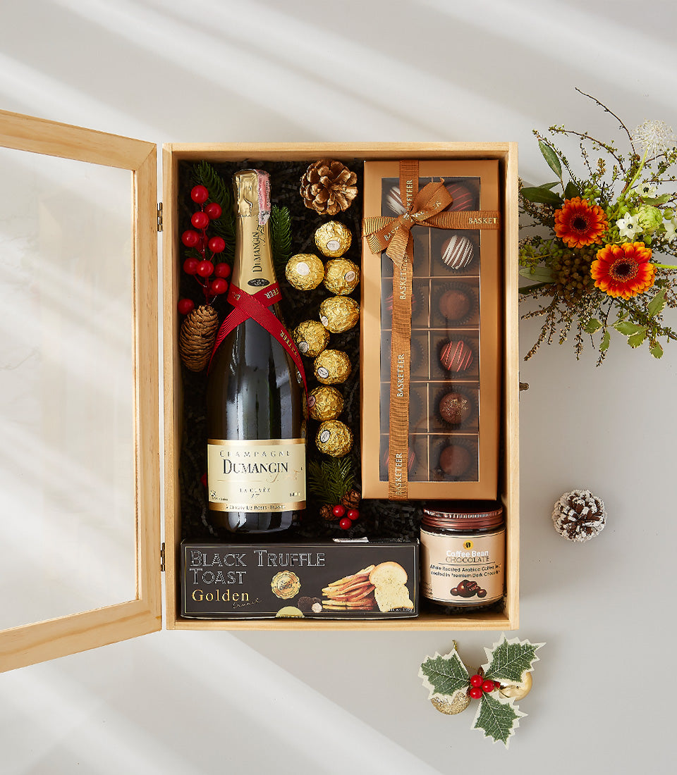 Dumangin Champagne gourmet gift box with chocolates, truffle toast, and coffee bean spread on black shredded paper