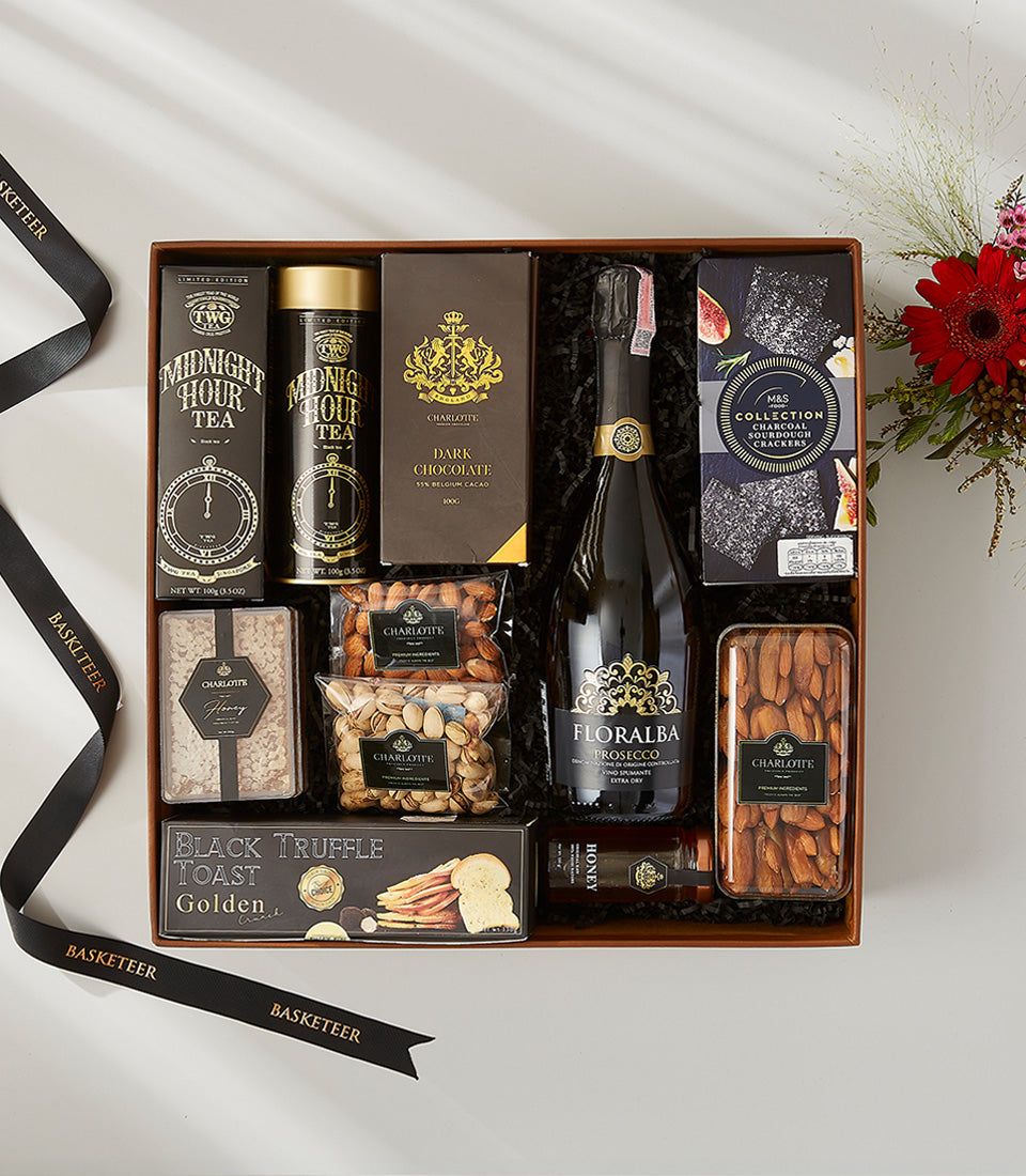 Luxury Floralda Prosecco gift box with gourmet tea, chocolate, crackers, nuts and honey, paired with red roses