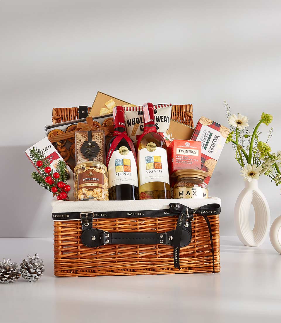 Premium wicker gift basket with red and white wine, gourmet crackers, tea, coffee, chocolate, and shortbread