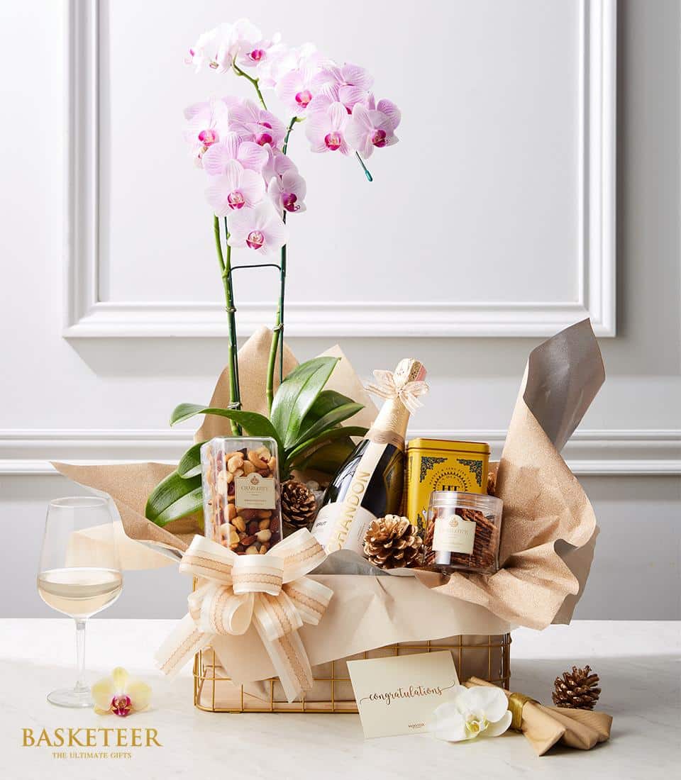 Champagne & pink orchid luxury gift basket with sparkling wine, nuts, and celebration ribbon