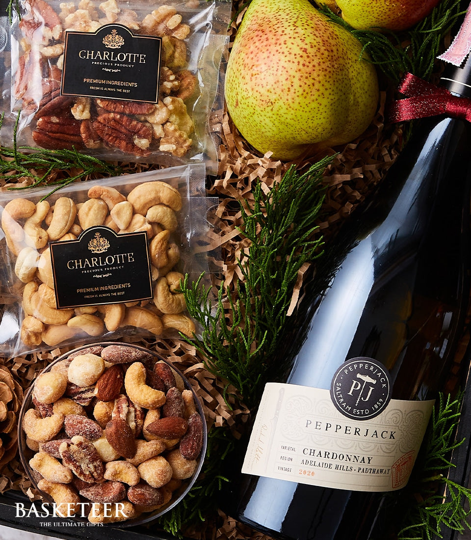 Pepperjack Chardonnay white wine gift hamper with roasted nuts, pears, and gourmet snacks in luxury basket