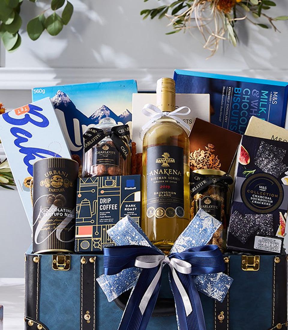 Luxury blue leather chest hamper with white wine, chocolate biscuits, truffle chocolates, and gourmet treats