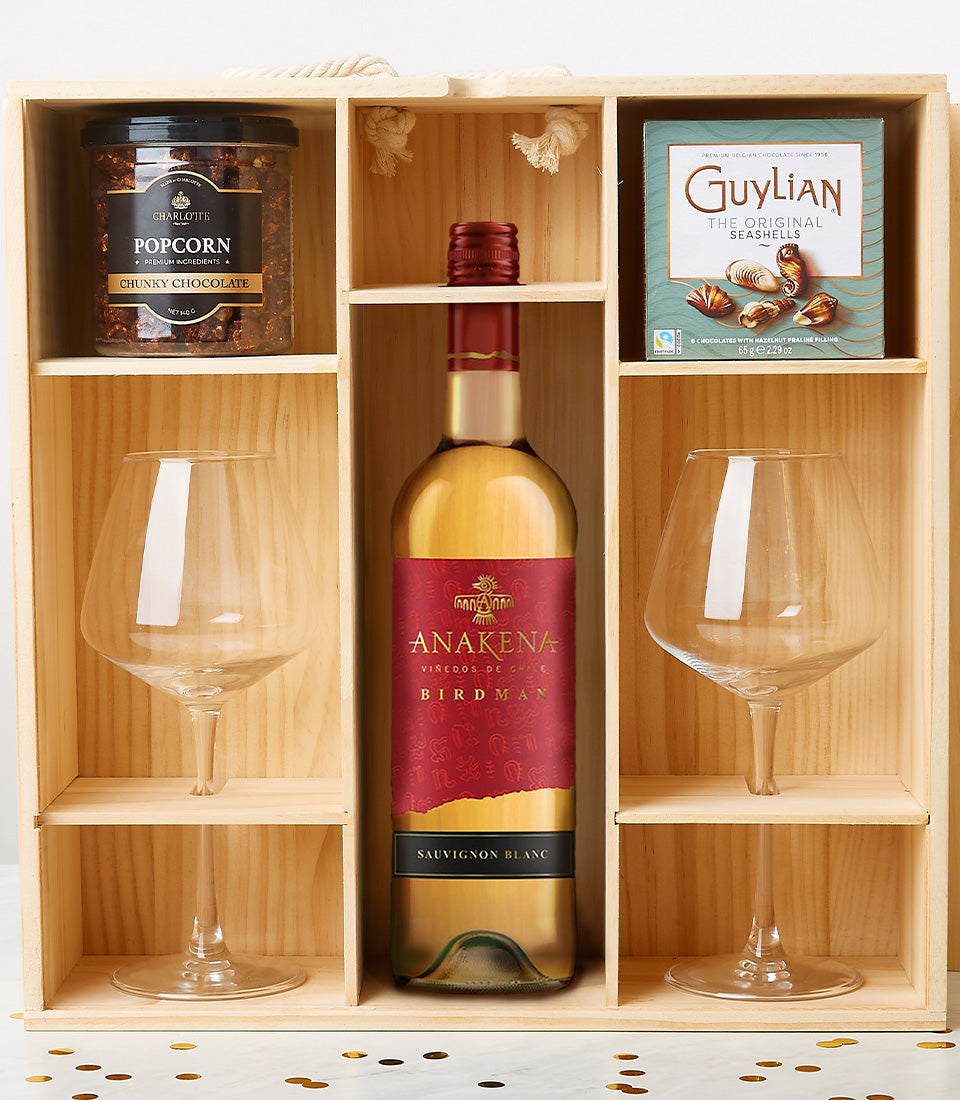 Luxury wooden wine gift box with Sauvignon Blanc, gourmet chocolates, popcorn, and stemmed glasses