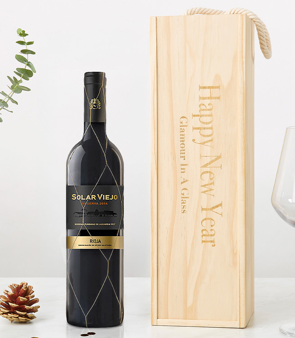 Elegant Rioja wine in engraved wooden gift box with festive New Year messaging and braided rope handle