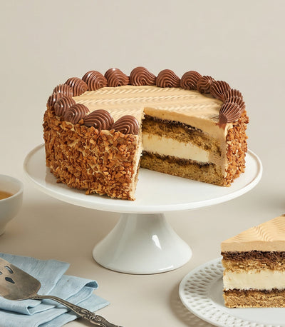 Charlotte Bakery's artisan round White Chocolate Mocha Almond Cake, featuring a rid
