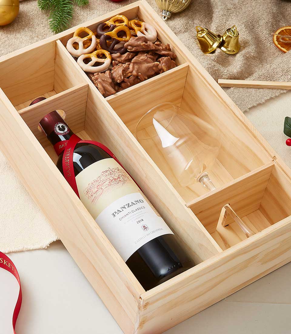 Premium wooden gift box with Panzano Chianti red wine, wine glass, and gourmet chocolate treats