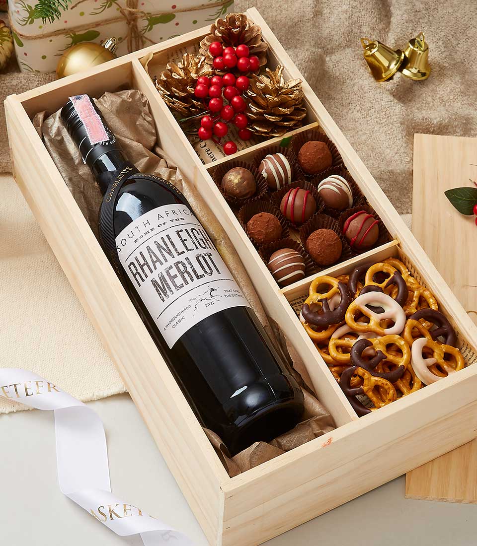 Premium wine and chocolate gift set in wooden box with Merlot, gourmet truffles, and festive golden accents