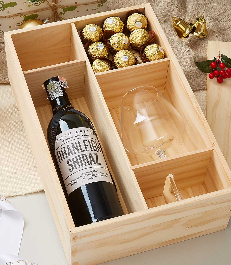 Premium wooden wine gift box with Shiraz, wine glass, and gold-foil chocolates
