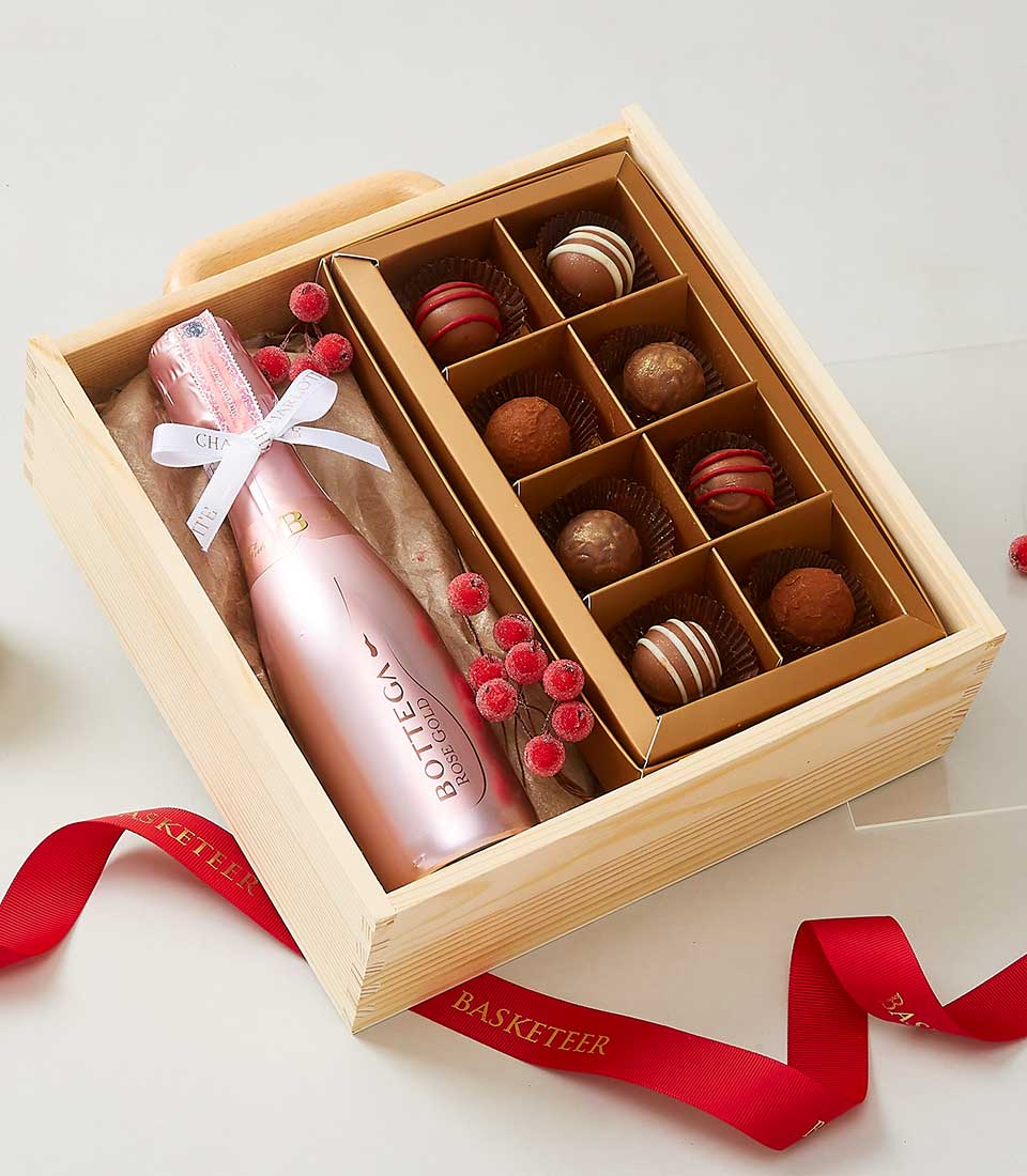 Rose gold sparkling wine and chocolate truffles gift set in wooden box with white ribbon