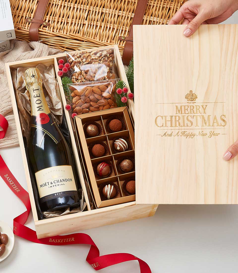 Moët & Chandon champagne with chocolate truffles and nuts in sliding wooden gift crate