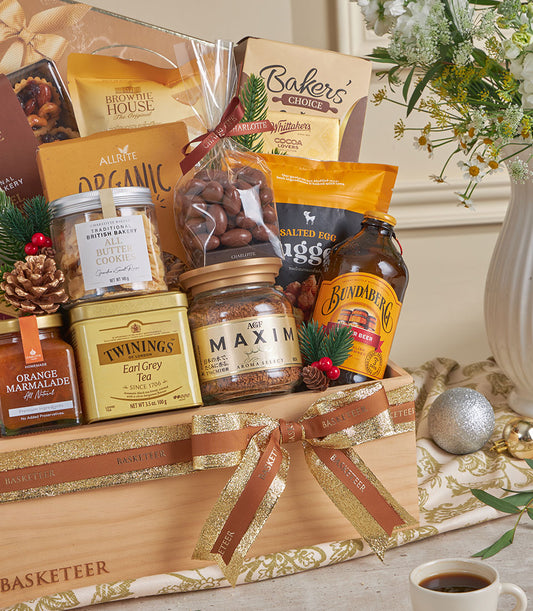 Basketeer luxury gift basket Bangkok. Wooden hamper with Earl Grey tea, marmalade, cookies and chocolate almonds. Tied with a gold ribbon. Premium corporate gift.