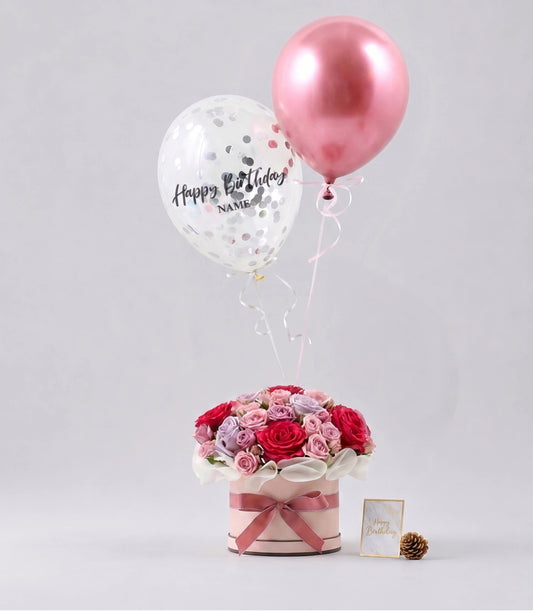 A luxurious Basketeer gift box with lush pink, red, and lavender roses