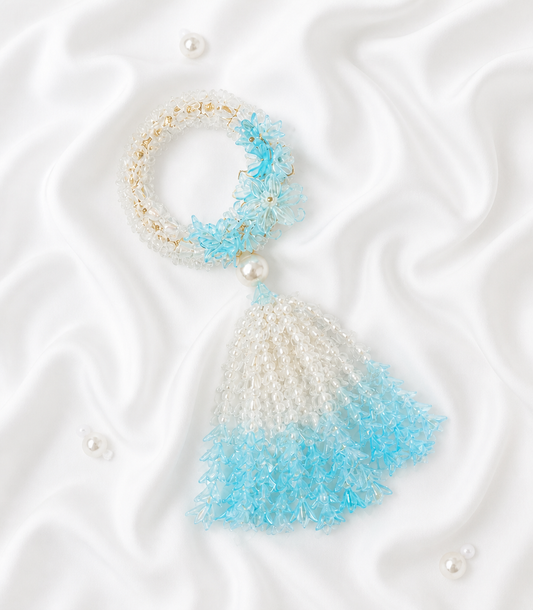 Luxurious Basketeer gift featuring a handcrafted beaded jasmine garland in clear, gold,