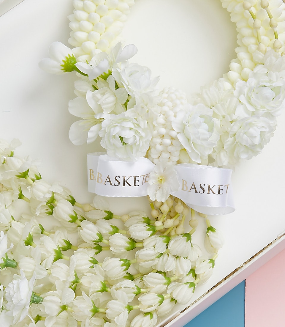 Elegant white jasmine garland with satin ribbon in gift box, Mother's Day present