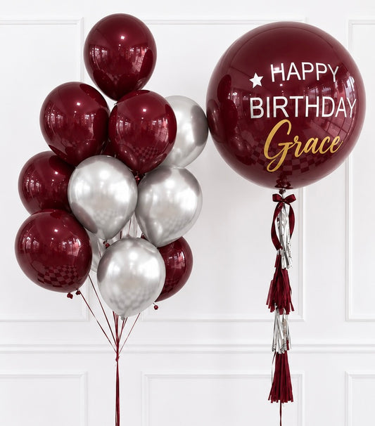 Basketeer's luxurious birthday balloon gift featuring a large burgundy balloon personalized