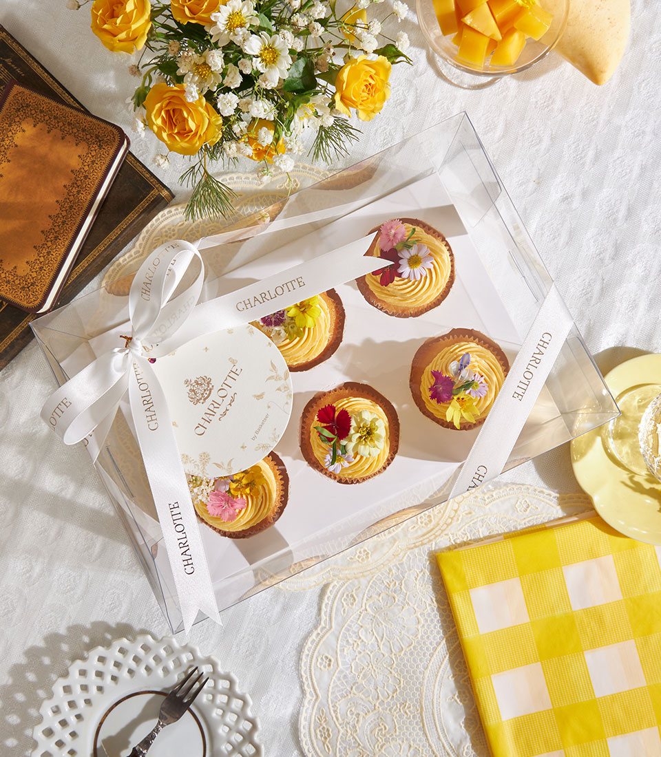 Golden mango buttercream tarts with edible flowers, Charlotte Bakery artisan box set