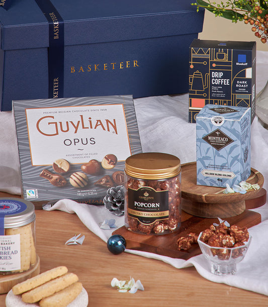 Premium New Year gourmet gift basket with chocolates, specialty coffee, oolong tea, and artisan popcorn