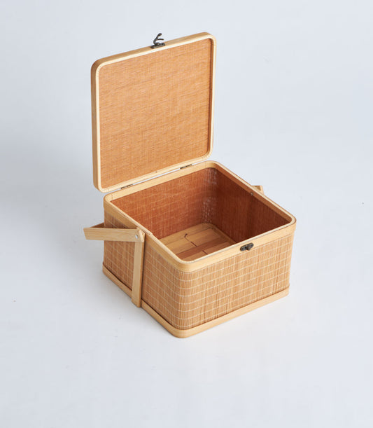 Natural woven bamboo square basket with wooden lid, handle, and metal clasp for storage or gifting