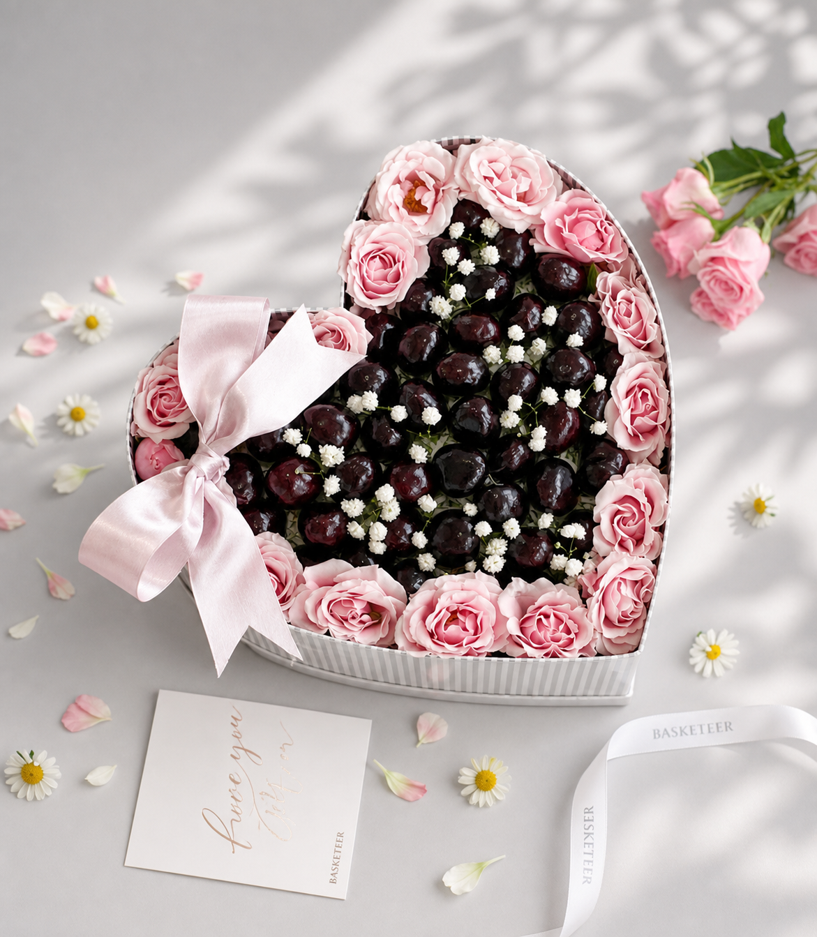 A luxurious heart-shaped flower box by Flowers by Basketeer, featuring