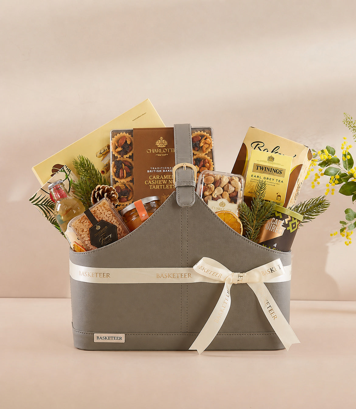 Basketeer premium grey faux leather gift bag with cream ribbon, filled with Charlotte