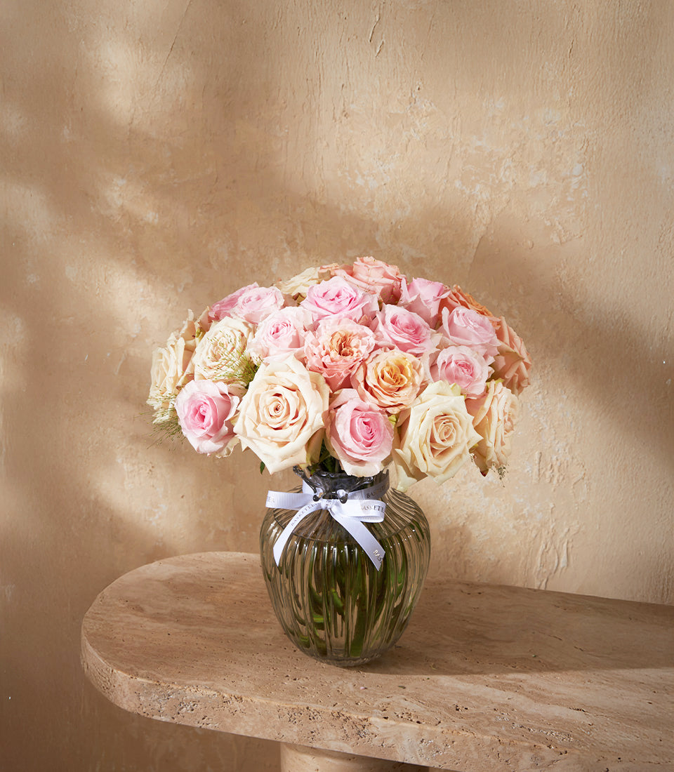 Lush arrangement of premium blush, cream, and delicate pink roses in