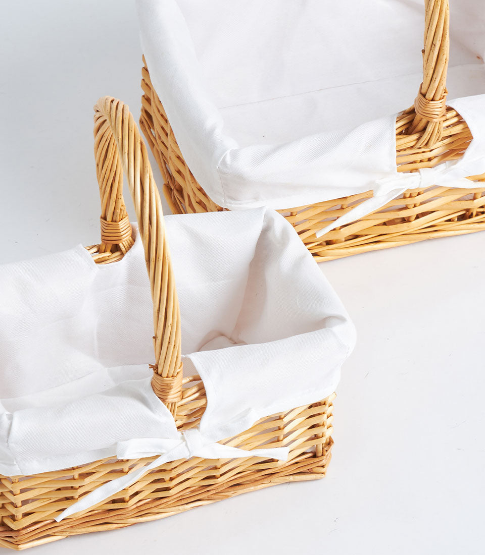 Basketeer's premium handwoven wicker gift basket with elegant white fabric