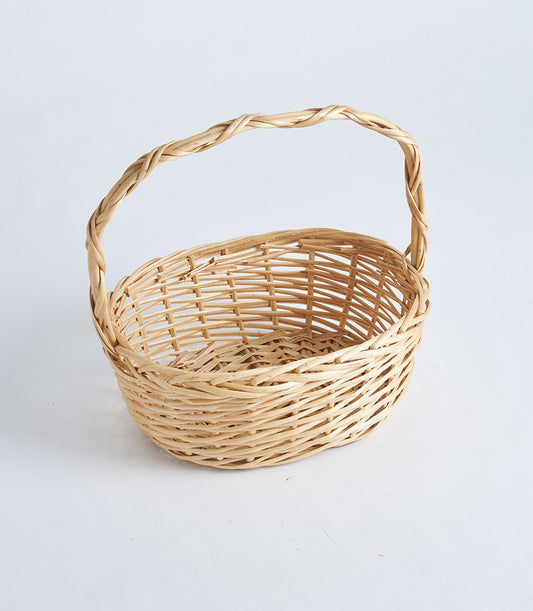 Natural wicker oval basket with twisted handle, light tan handwoven rattan