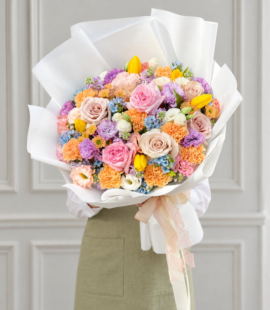 Angled studio view of colorful pastel flower bouquet
