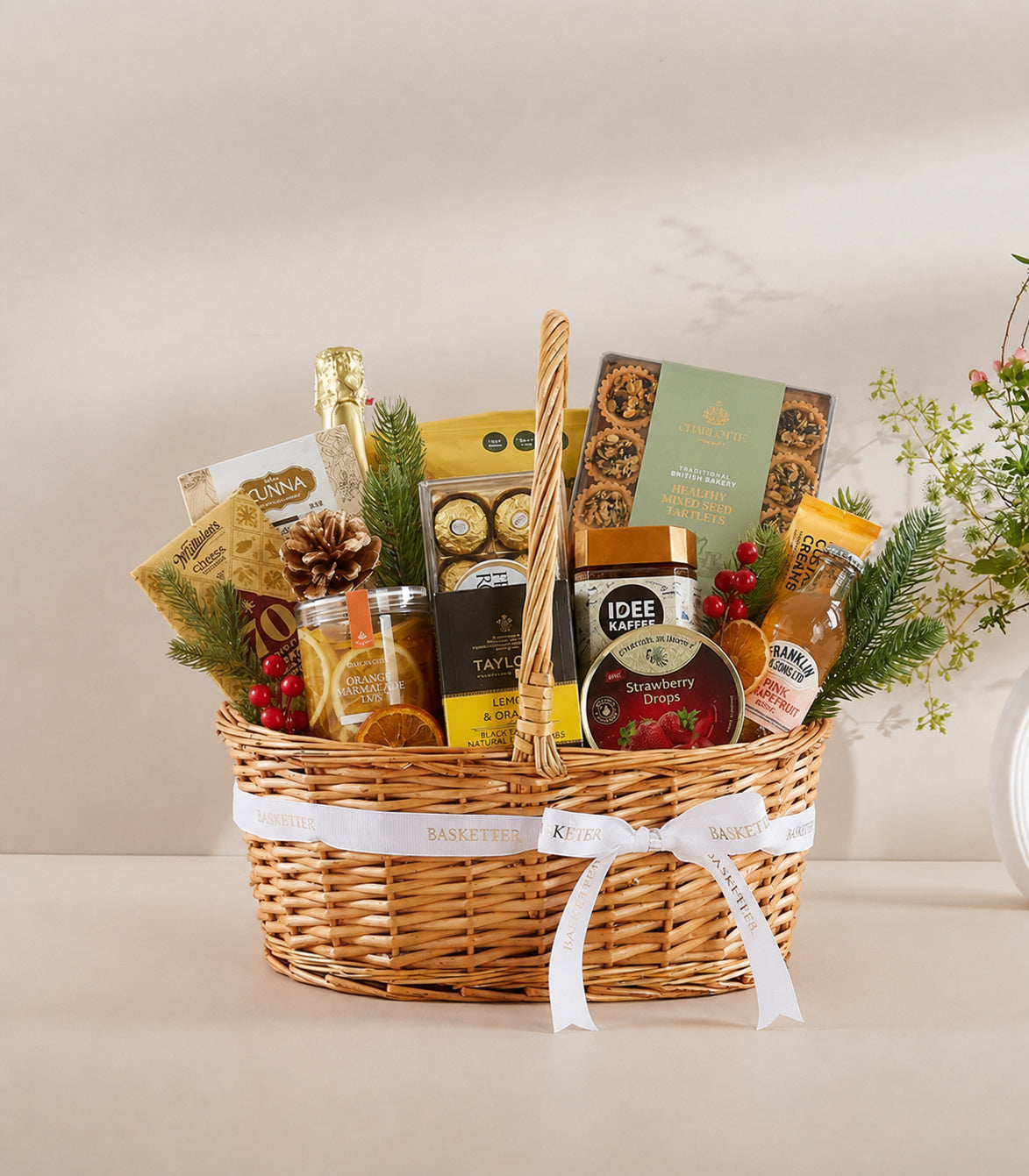 Basketeer luxury gift basket with a woven wicker hamper, adorned with