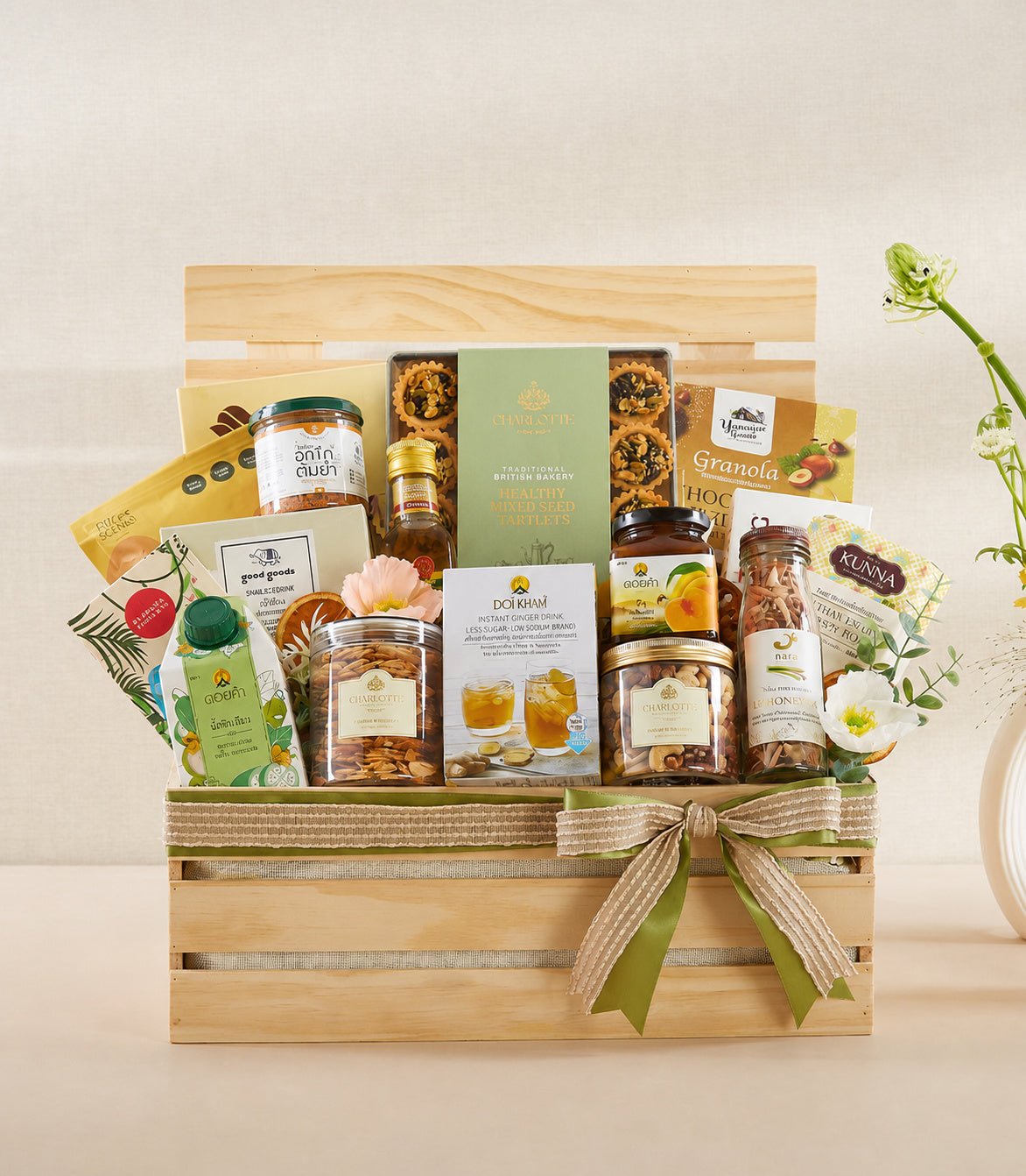 Basketeer premium organic gift hamper in a wooden crate, adorned with burlap and