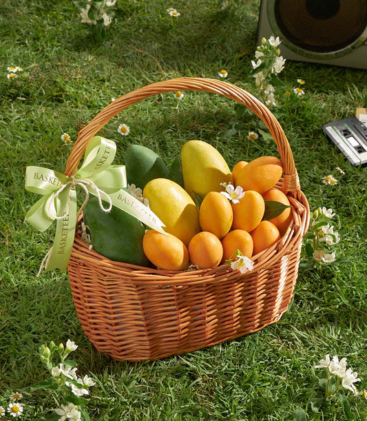 Premium mixed mango and mayongchid tropical fruit gift basket with light green ribbon bow