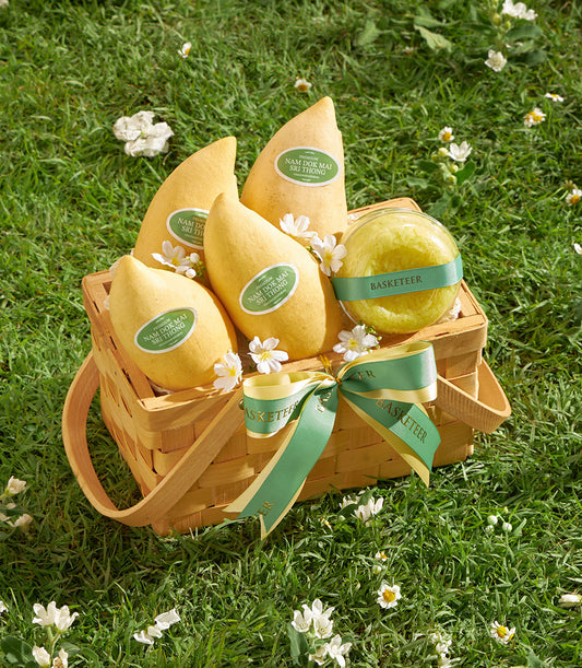 Premium Nam Dok Mai mango basket with sticky rice and white flowers in woven basket